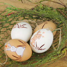 Lade das Bild in den Galerie-Viewer, Ostereier 12er Set braun weiß mit Osterhasen